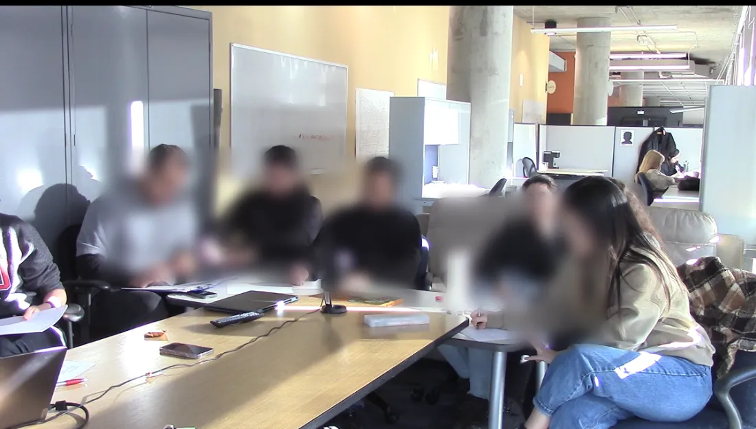Focus group session in progress. Participant faces are blurred.